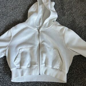 SHEIN cropped white zip up. It’s short on my arms (i have lengthy arms)